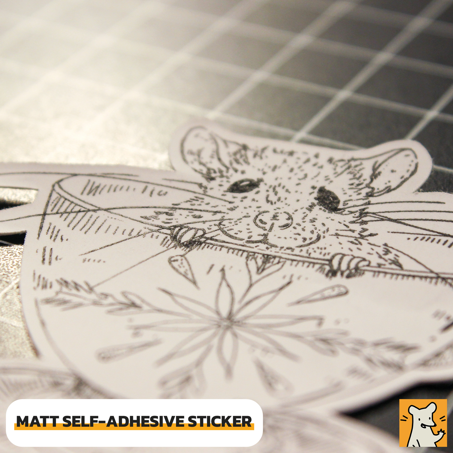 Close-up of a hand-drawn matt self-adhesive sticker featuring a cute baby rat design.