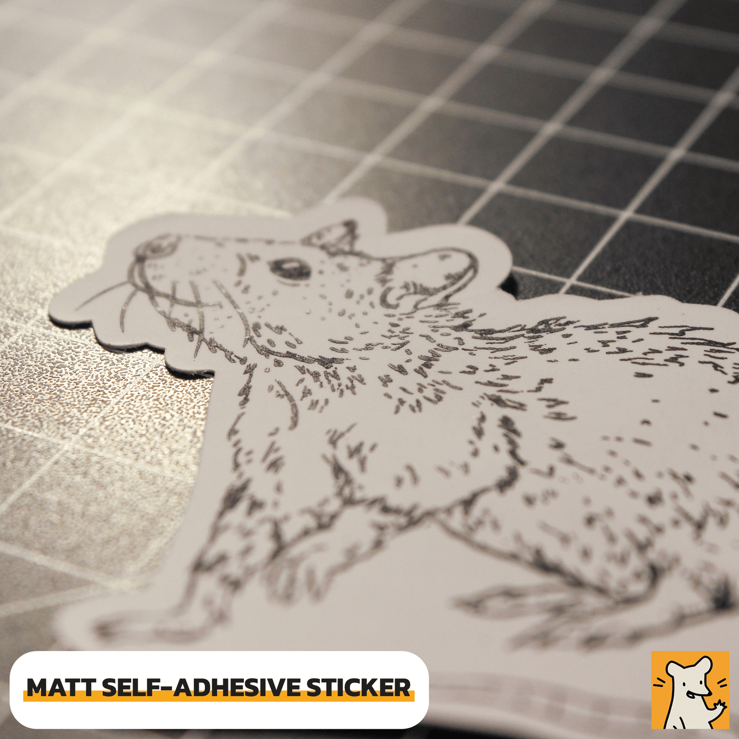 Close-up of a matte self-adhesive rat sticker featuring a hand-illustrated design on a grid background.